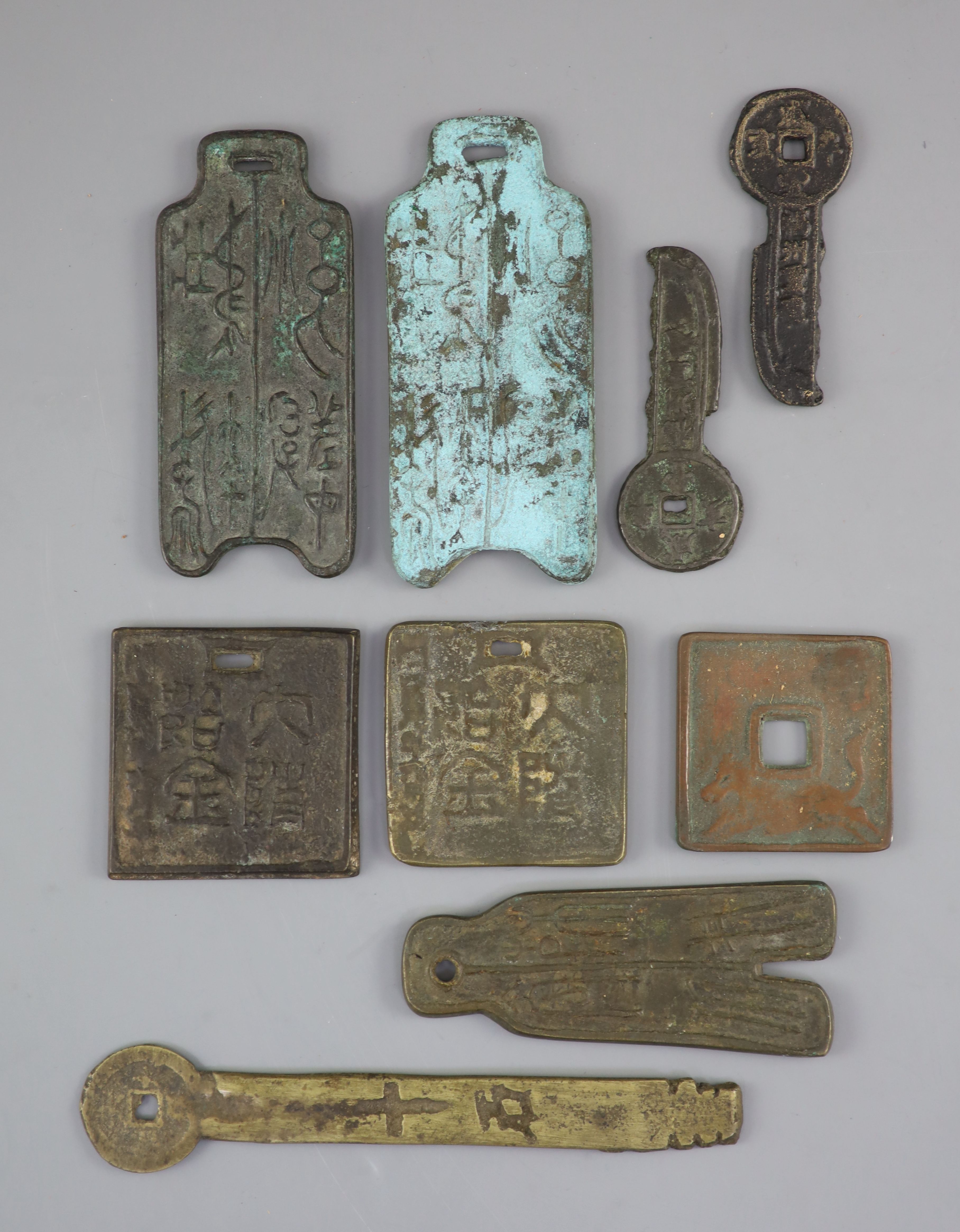 China, 9 large bronze charms or amulets, Qing dynasty-20th century
